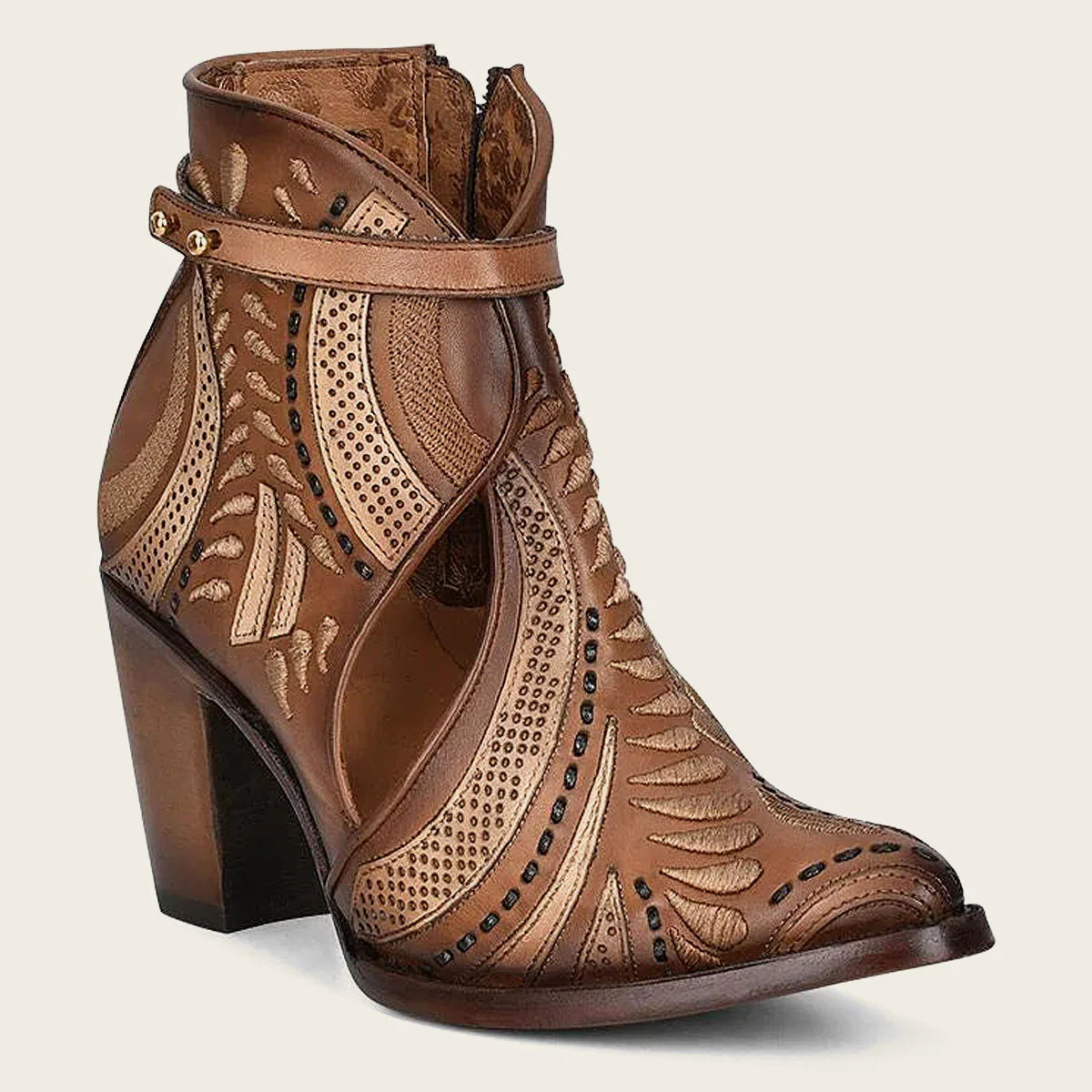 Embroidered and perforated in geometric motifs honey leather bootie