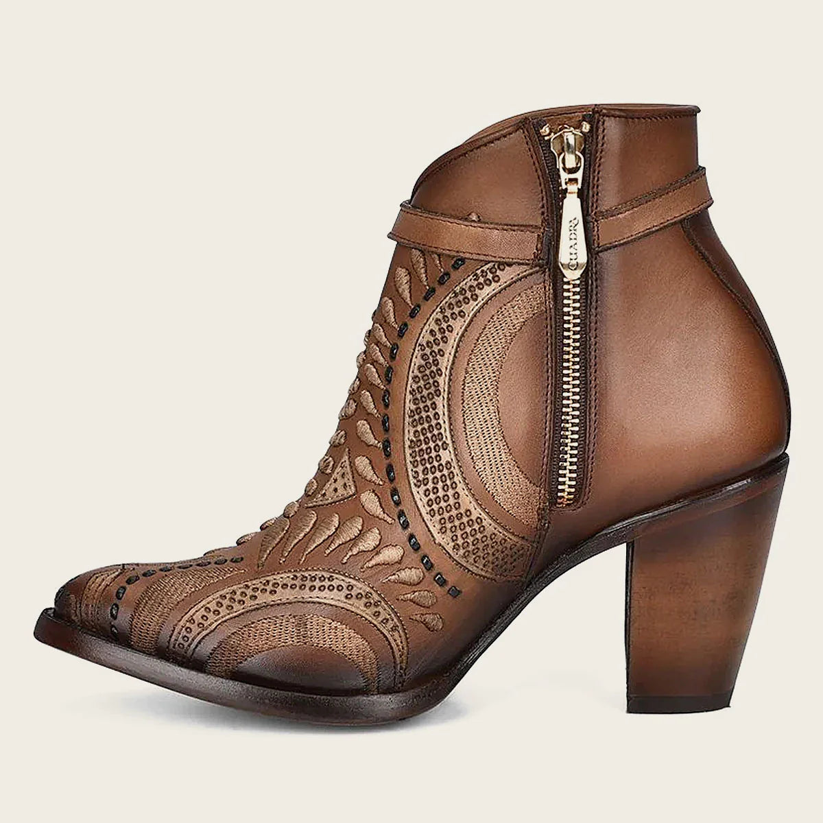 Embroidered and perforated in geometric motifs honey leather bootie